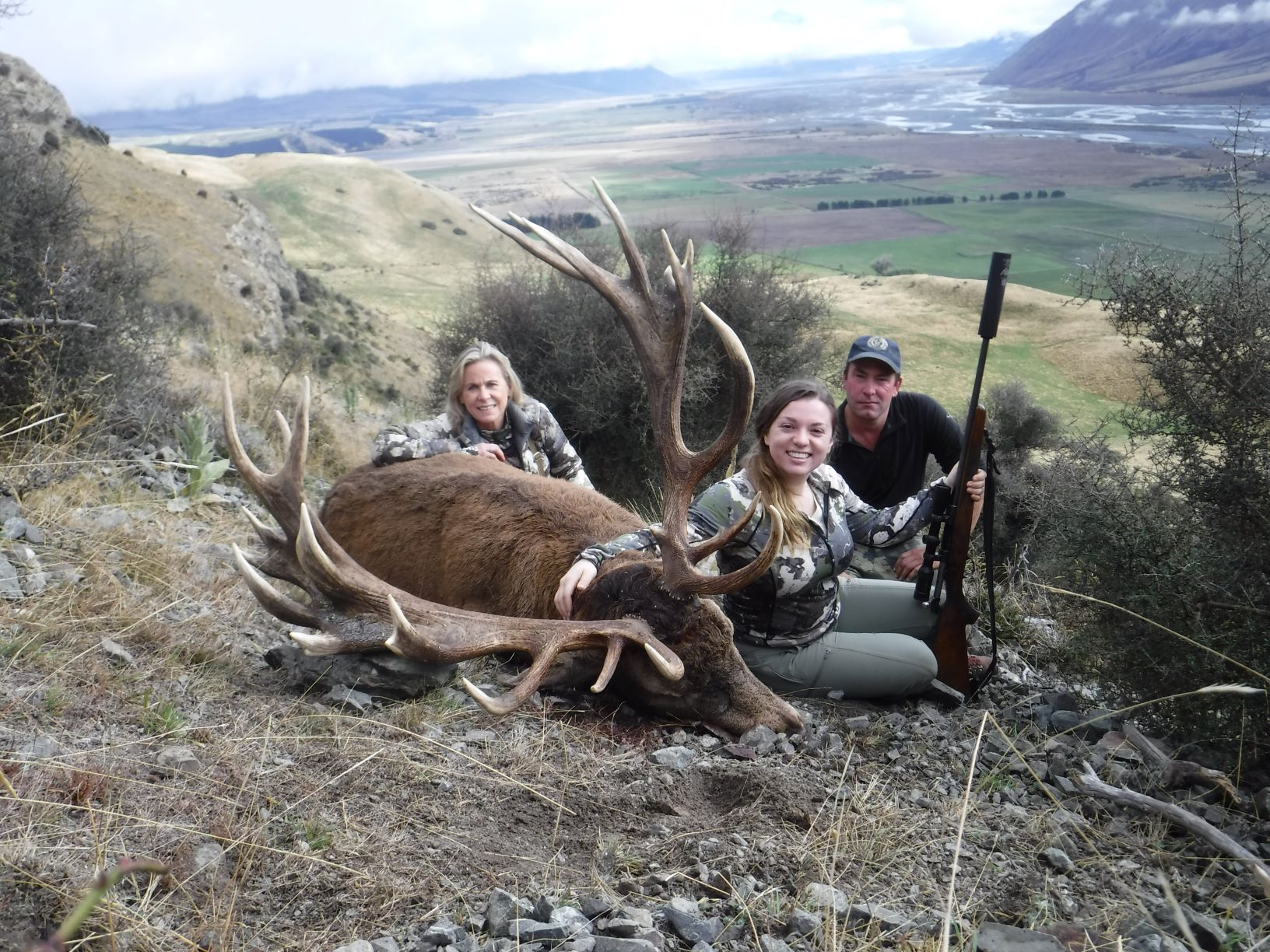 : Donna and Caroline Boddington and outfitter Chris Bilkey with a gorgeous New Zealand red stag, taken by Caroline with a single 140-grain Remington Core-Lokt from a Sako 7mm-08.