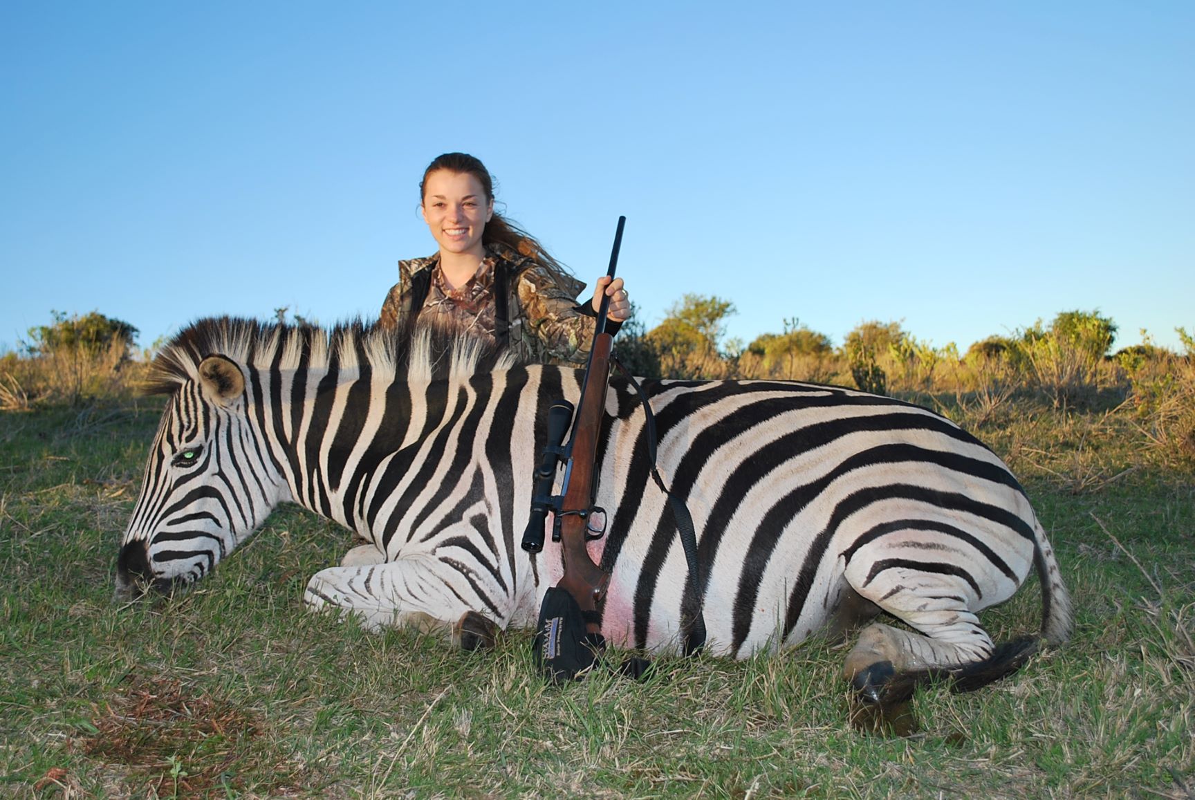 : Caroline Boddington with a big zebra stallion, taken cleanly with a single 140-grain bullet from a CZ 7mm-08.