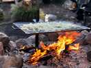 Everyone knows that food tastes better when cooked outside but cook that food over an open fire and it will taste amazing. The Camp Chef Mountain Man Over Fire Grill & Griddle let you cook like mounta...